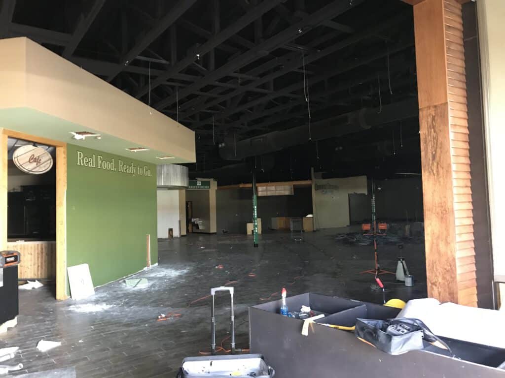 Empty retail space undergoing renovation, with 