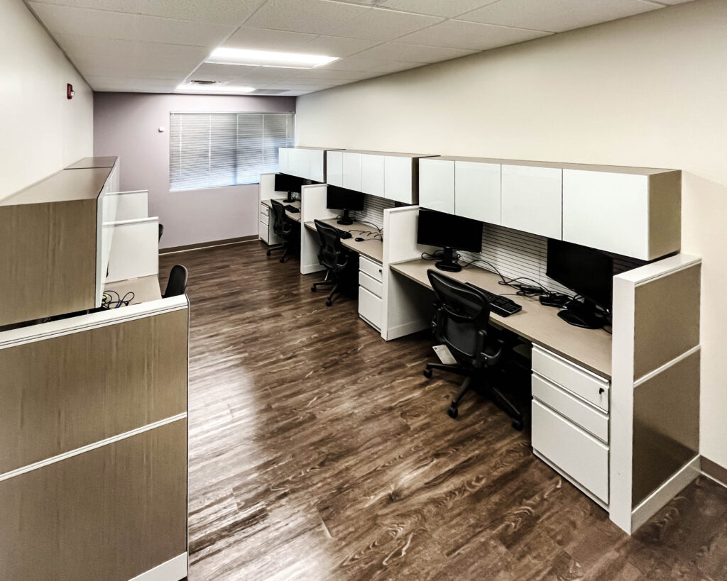 Office space with cubicles and desks for a professional portfolio.